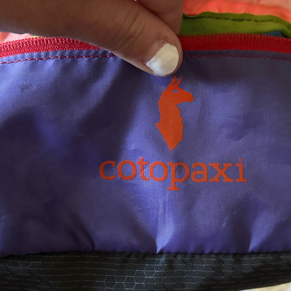 Cross body or belt bag. Multiple colors, very fun and cute. It functions great!